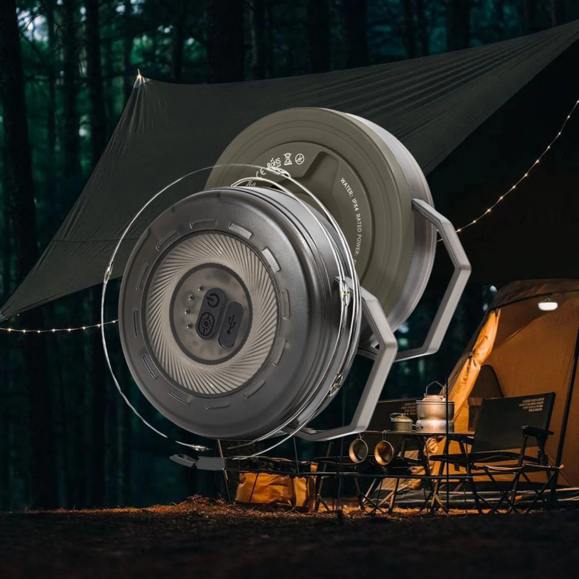 Campify String fairy light reel held in hand at night, showing warm amber LED string lights extended across dark outdoor ground, compact hub glowing with blue charge indicator, IP67 waterproof camping and home fairy lights.