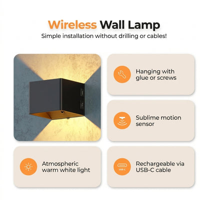 LUNIFY Boca compact aluminium wall light mounted on a slatted wood wall, casting a warm 2700K up-and-down glow. Wireless rechargeable LED wall lamp with motion sensor and magnetic mounting for wire-free indoor installation.