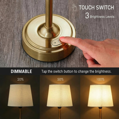 AMBIENTIFY Classic cordless table lamp with fabric shade and iron stem, casting warm ambient light on a bedside table. Three brightness settings and up to 40 hours battery life. Suitable for bedroom, living room and home office.